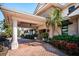 Beautiful waterfront home with an inviting entrance, lush landscaping, and a brick paved driveway at 4998 62Nd S Ave, St Petersburg, FL 33715