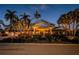 Charming waterfront home with lush landscaping, brick driveway, and a welcoming front entrance at 4998 62Nd S Ave, St Petersburg, FL 33715
