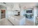 Spacious kitchen featuring a central island, breakfast nook, and stainless steel appliances offers ample cooking space at 4998 62Nd S Ave, St Petersburg, FL 33715