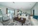 Bright living room featuring waterfront view and cozy seating arrangement at 4998 62Nd S Ave, St Petersburg, FL 33715