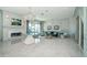 Spacious living room with fireplace, water views, stylish furnishings, and ample natural light at 4998 62Nd S Ave, St Petersburg, FL 33715