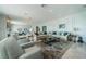 Spacious living room featuring modern decor, fireplace, and plush seating at 4998 62Nd S Ave, St Petersburg, FL 33715