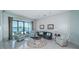 Bright living room with water views, comfortable seating, and sliding glass doors to the outdoor space at 4998 62Nd S Ave, St Petersburg, FL 33715