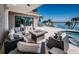 Waterfront patio featuring a comfortable seating area, a fire pit, and a stunning view of the bay at 4998 62Nd S Ave, St Petersburg, FL 33715