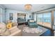 Sitting room with bay views, stylish seating, and access to the waterfront deck at 4998 62Nd S Ave, St Petersburg, FL 33715