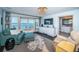 Living area with deck access, ample seating, and white built-ins by the water at 4998 62Nd S Ave, St Petersburg, FL 33715