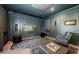 Home theater room with comfortable seating, large screen, and custom paneling at 4998 62Nd S Ave, St Petersburg, FL 33715