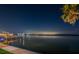 Nighttime waterfront view with city lights reflecting on the calm water at 4998 62Nd S Ave, St Petersburg, FL 33715