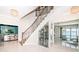 Staircase landing with wine cellar, water views and elegant design at 4998 62Nd S Ave, St Petersburg, FL 33715