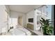 Bright bedroom with floor-to-ceiling windows offering outdoor views, complemented by contemporary furnishings at 5120 Marina Way # 21206, Tampa, FL 33611
