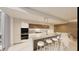 Modern kitchen with island, pendant lighting, and stainless steel appliances at 5120 Marina Way # 21206, Tampa, FL 33611