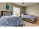 Bedroom featuring twin beds, surf board art, and plantation shutters at 5243 6Th Way N, St Petersburg, FL 33703