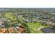 Scenic aerial view of a residential area with golf course, waterways, and lush landscaping at 5310 Huntingwood Ct # 40, Sarasota, FL 34235