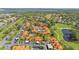 Aerial shot of a condo community featuring manicured lawns and a nearby golf course at 5310 Huntingwood Ct # 40, Sarasota, FL 34235