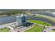 Aerial view of the building and surrounding landscape with water and parking at 5310 Huntingwood Ct # 40, Sarasota, FL 34235