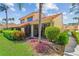 Backyard featuring a screened-in porch, mature landscaping, and a serene outdoor space at 5310 Huntingwood Ct # 40, Sarasota, FL 34235
