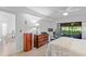 Bedroom featuring a dedicated workspace with a large window providing natural light and views to the outside at 5310 Huntingwood Ct # 40, Sarasota, FL 34235