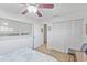 Bedroom featuring ample closet space, neutral colors, and a ceiling fan at 5310 Huntingwood Ct # 40, Sarasota, FL 34235