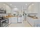 Efficient kitchen with stainless steel appliances, granite counters, and ample cabinet space at 5310 Huntingwood Ct # 40, Sarasota, FL 34235