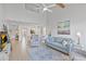 Bright living room with vaulted ceilings, modern furnishings, and wood-style floors at 5310 Huntingwood Ct # 40, Sarasota, FL 34235