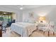 Serene main bedroom with sliding glass doors, neutral tones, and a calming atmosphere at 5310 Huntingwood Ct # 40, Sarasota, FL 34235