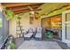 Screened-in patio features comfortable seating, decorative plants, and seamless indoor-outdoor flow at 5310 Huntingwood Ct # 40, Sarasota, FL 34235