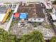 Aerial view of house featuring backyard, several cars, and adjacent properties at 5607 Larimer Dr, Tampa, FL 33615