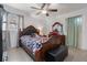 Bedroom with luxurious bed, dresser, and natural lighting from the windows, creating a relaxing atmosphere at 5607 Larimer Dr, Tampa, FL 33615