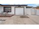 View of house featuring an attached garage, a cozy front porch, and ample parking space at 5607 Larimer Dr, Tampa, FL 33615