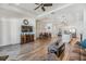 Spacious living room with hardwood floors, a decorative fireplace, and ample natural light at 5734 Stockport St, Riverview, FL 33578