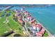 Aerial view of a community with a golf course and waterway access, all with red tile roofs at 6051 Sun Blvd # 601, St Petersburg, FL 33715