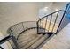 View of an interior spiral stairwell with neutral walls and black metal railing at 6051 Sun Blvd # 601, St Petersburg, FL 33715