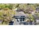 Aerial view of a two-story townhome features two-car garages, neutral paint, and a neatly manicured lawn at 6218 Greenleaf Ln # 6218, Temple Terrace, FL 33617