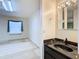 Bathroom featuring sink, mirror, and lots of light at 6218 Greenleaf Ln # 6218, Temple Terrace, FL 33617