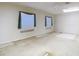 Spacious bedroom with two windows and a ceiling fan provides ample natural light at 6218 Greenleaf Ln # 6218, Temple Terrace, FL 33617