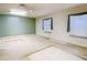 Bedroom features a large window, neutral walls, and a ceiling fan at 6218 Greenleaf Ln # 6218, Temple Terrace, FL 33617