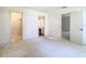 A bright bedroom featuring doorways leading to closet and bathroom at 6218 Greenleaf Ln # 6218, Temple Terrace, FL 33617