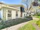 Delightful home exterior with awning over the front door and beautifully framed windows, creating a warm and inviting curb appeal at 6218 Greenleaf Ln # 6218, Temple Terrace, FL 33617