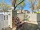 Enclosed front yard with a white fence and landscaped garden at 6218 Greenleaf Ln # 6218, Temple Terrace, FL 33617