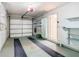 Bright garage featuring an automatic door, built-in storage, and access door at 6218 Greenleaf Ln # 6218, Temple Terrace, FL 33617