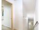 A hallway leads to the stairs and other rooms at 6218 Greenleaf Ln # 6218, Temple Terrace, FL 33617