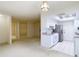 Bright kitchen featuring white cabinets, neutral countertops, tile floors, and stainless steel appliances at 6218 Greenleaf Ln # 6218, Temple Terrace, FL 33617