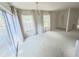 Bright living room featuring large windows and neutral carpet, creating a warm atmosphere at 6218 Greenleaf Ln # 6218, Temple Terrace, FL 33617