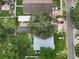Aerial view of residential property with mature trees and surrounding neighborhood at 8413 N Hamner Ave # A, Tampa, FL 33604