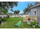 A well-maintained backyard with a putting green and a wooden deck, ideal for outdoor activities and entertaining at 8413 N Hamner Ave # A, Tampa, FL 33604