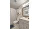 Bathroom with shower, mirror, and gray vanity at 8413 N Hamner Ave # A, Tampa, FL 33604