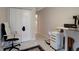 Bedroom showing a white accent chair, white closet, and tile flooring at 8413 N Hamner Ave # A, Tampa, FL 33604