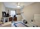 Bedroom with a ceiling fan, desk, and a comfortable office chair at 8413 N Hamner Ave # A, Tampa, FL 33604