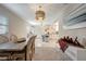 View of the open-concept dining and kitchen area, bright lighting, and light color palette at 8413 N Hamner Ave # A, Tampa, FL 33604
