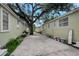 Exterior view of a street with light green apartments at 8413 N Hamner Ave # A, Tampa, FL 33604